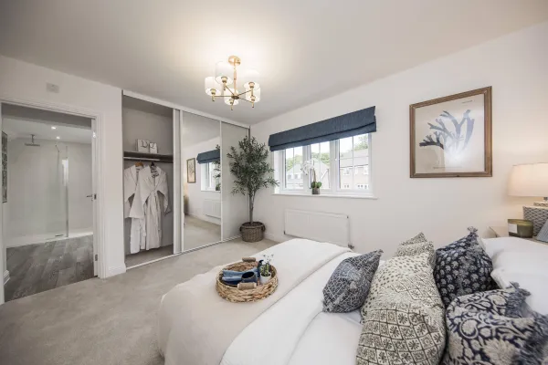 bedroom showing window and ensuite shower room