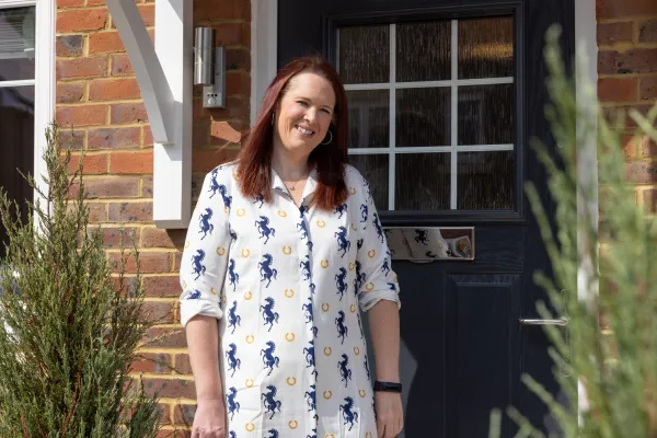Fay in front of her Bluebell home