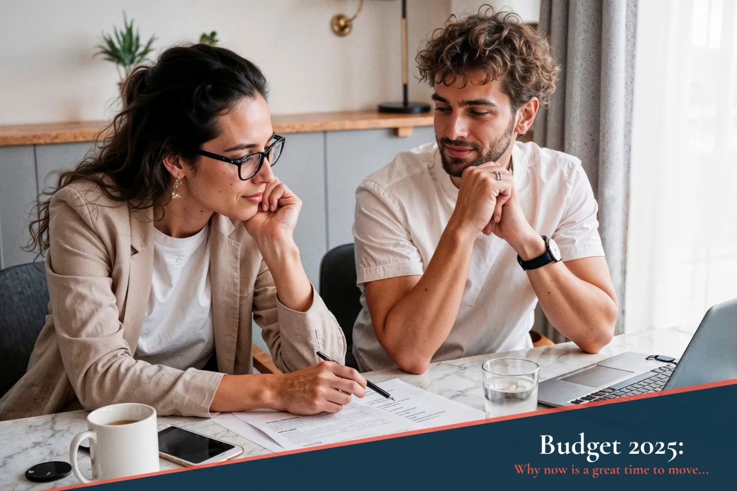 Autumn Budget -  a man and a woman sat looking at documents at a dining table