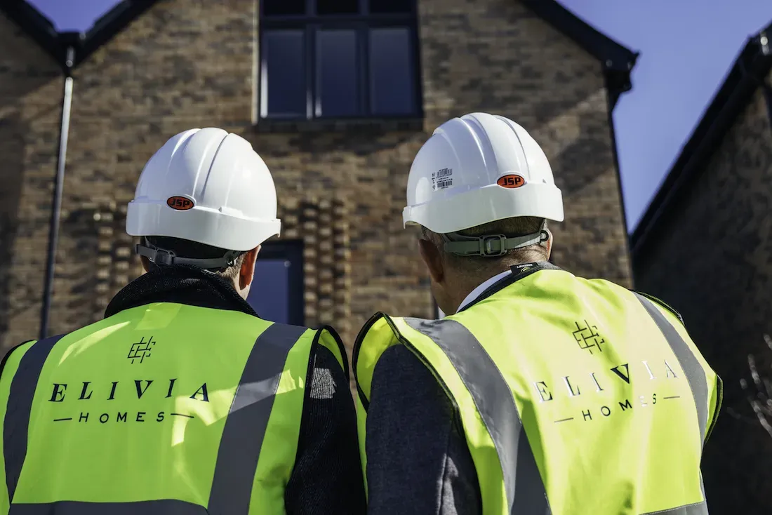 Elivia Builders in front of house