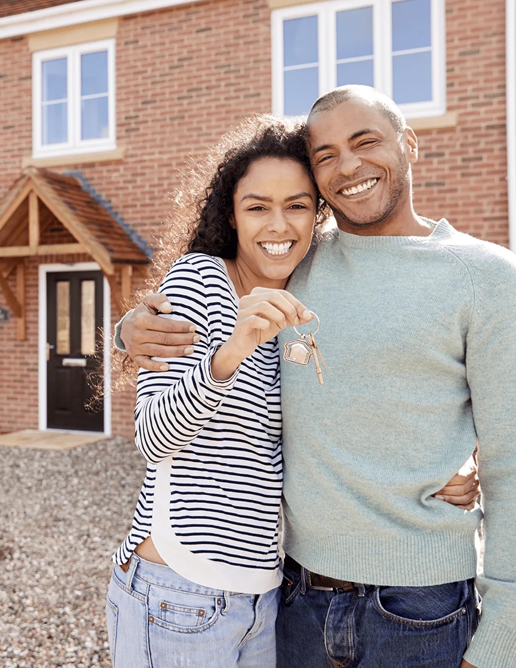 Couple holding house keys